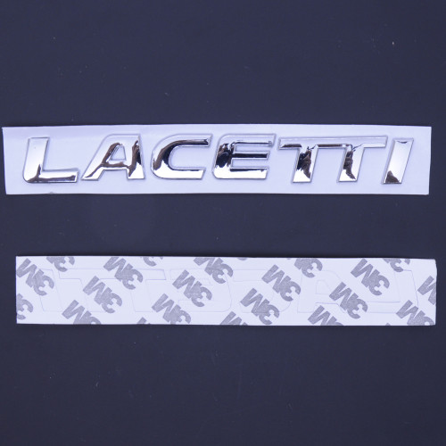 Емблема - напис "LACETTI" скотч 3M 174 *20мм (8992A(MTJ) Емблема - напис "LACETTI" скотч 3M 174 *20мм (8992A(MTJ)